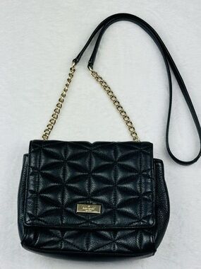 Kate Spade Quilted Black Leather Purse with Gold Chain and Metal Accents.